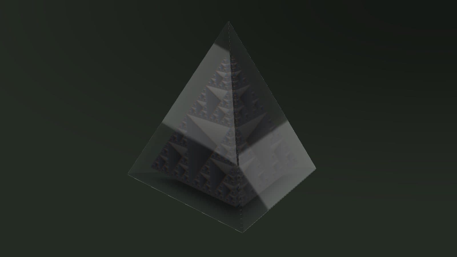 A glass tetrahedron holding a pale fractal mesh, lit against a charcoal studio